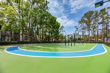 Outdoor fitness court with track